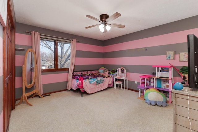 bedroom featuring a ceiling fan, baseboards, and carpet floors