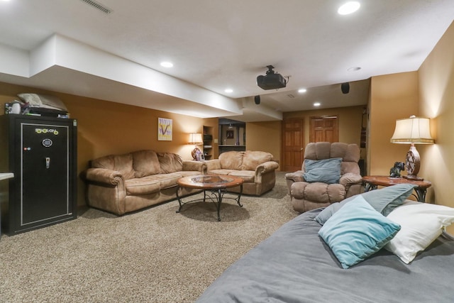 living area featuring carpet flooring, recessed lighting, and visible vents