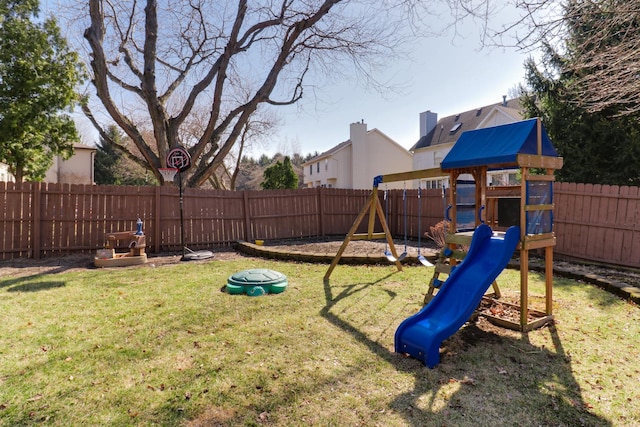 view of jungle gym featuring a fenced backyard and a yard