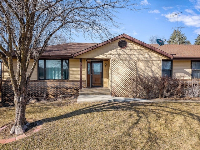 ranch-style house with brick siding and a front yard