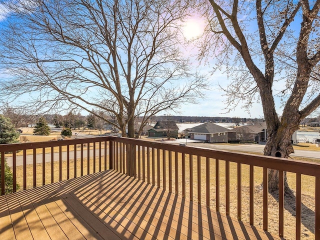 wooden terrace featuring a residential view