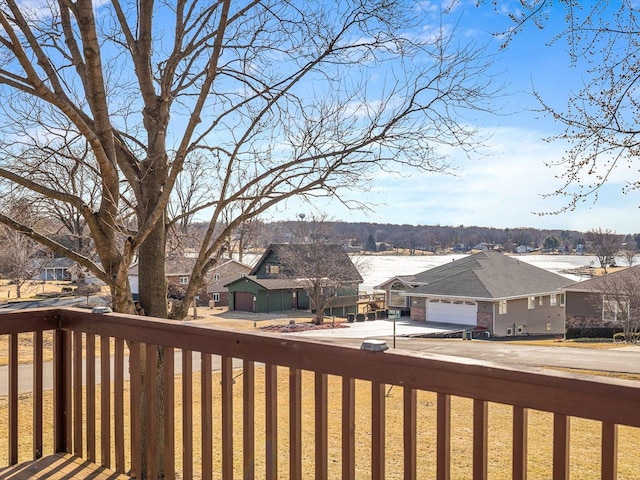 wooden deck featuring a residential view