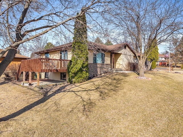 exterior space featuring brick siding, stairway, a lawn, and a deck