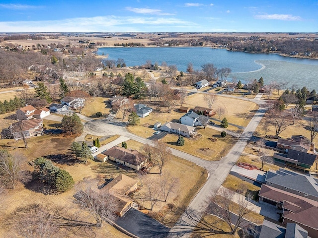 drone / aerial view featuring a residential view and a water view