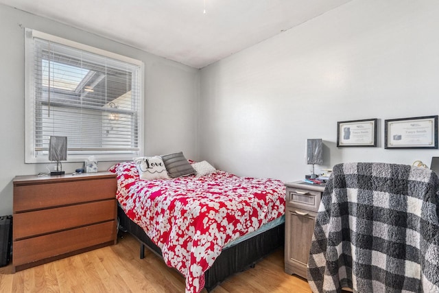 bedroom featuring light wood finished floors