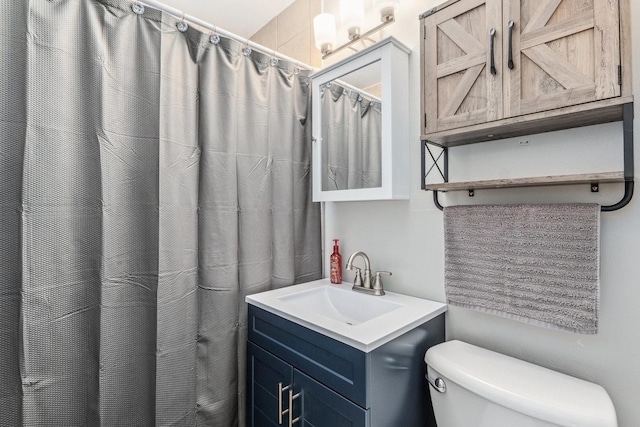 bathroom with toilet and vanity