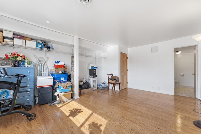 home office with wood finished floors