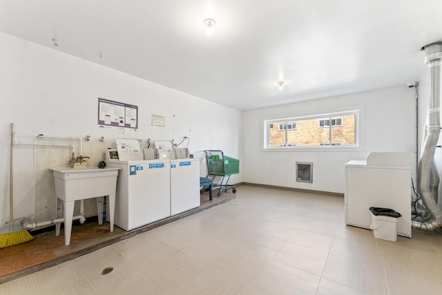 common laundry area featuring separate washer and dryer