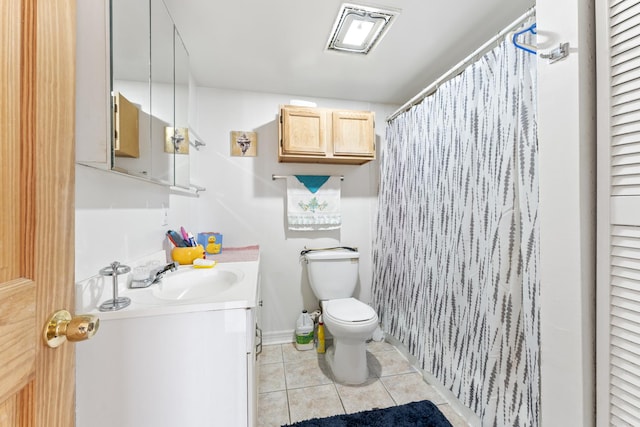 bathroom with curtained shower, toilet, vanity, and tile patterned flooring