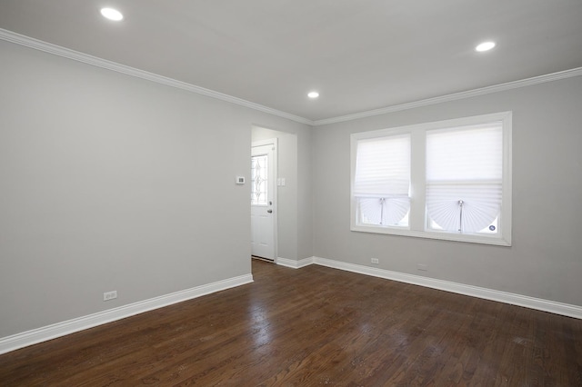 unfurnished room featuring dark wood finished floors, recessed lighting, baseboards, and ornamental molding