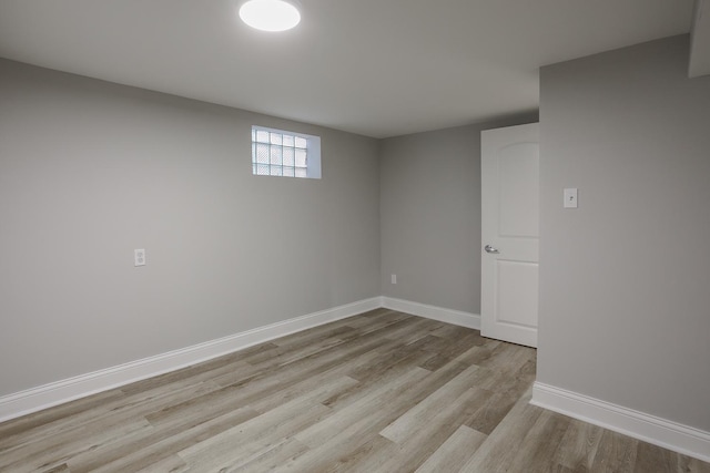 unfurnished room featuring light wood-style flooring and baseboards