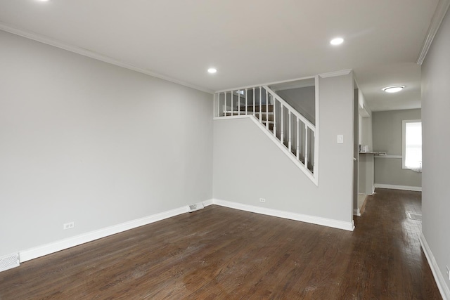 unfurnished room with wood finished floors, baseboards, recessed lighting, ornamental molding, and stairs