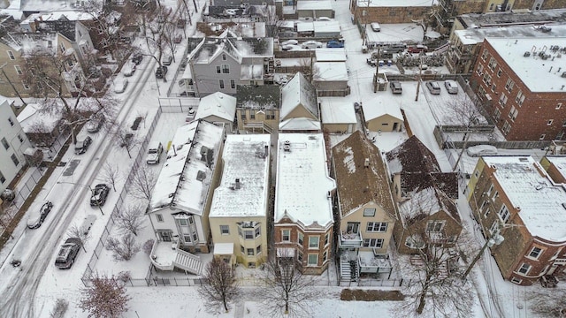 snowy aerial view featuring a residential view