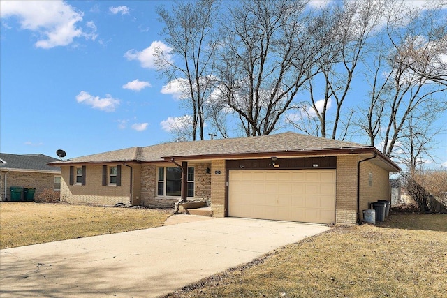 ranch-style house featuring brick siding, an attached garage, driveway, and a front lawn