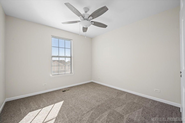 unfurnished room with visible vents, baseboards, carpet, and ceiling fan