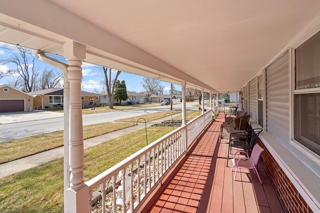 wooden terrace with a residential view