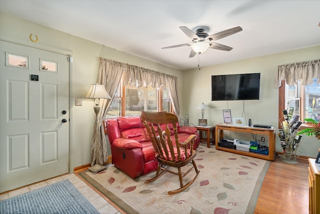 living room featuring ceiling fan and wood finished floors