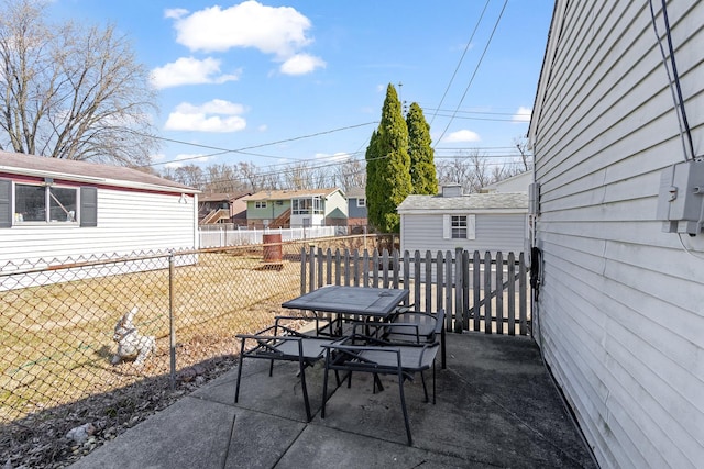 view of patio with outdoor dining space and fence