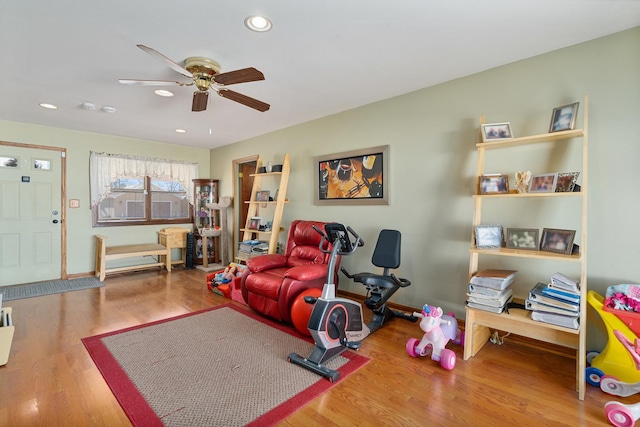 interior space featuring recessed lighting, baseboards, wood finished floors, and a ceiling fan