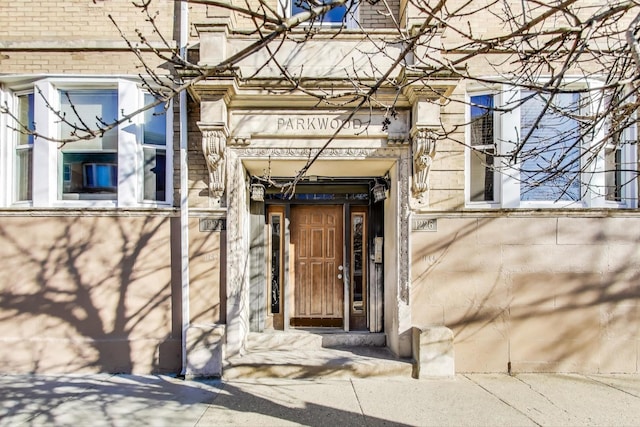 property entrance with brick siding