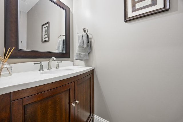 bathroom featuring vanity and baseboards