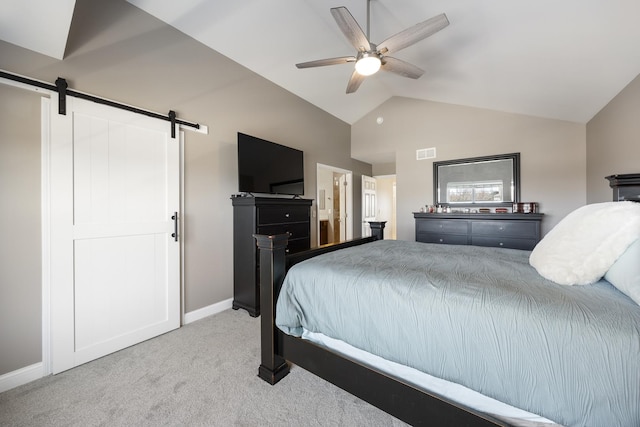 bedroom featuring visible vents, baseboards, lofted ceiling, a barn door, and carpet floors