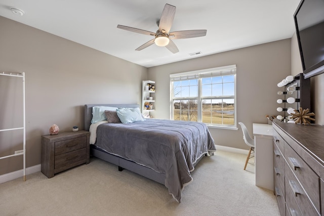 bedroom with visible vents, light colored carpet, a ceiling fan, and baseboards