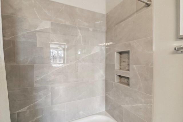 bathroom featuring a tub, a shower, and a ceiling fan