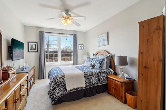 bedroom featuring a ceiling fan and light carpet