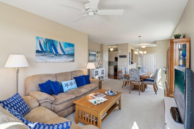 living room with light carpet and ceiling fan with notable chandelier