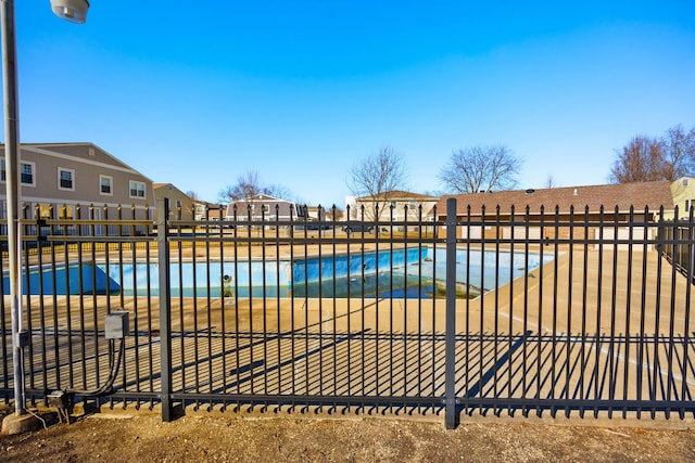 pool featuring a residential view and fence