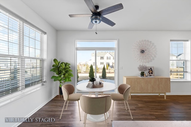 dining room featuring a ceiling fan, wood finished floors, and baseboards