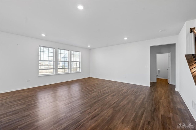 unfurnished living room featuring recessed lighting, baseboards, and dark wood-style flooring