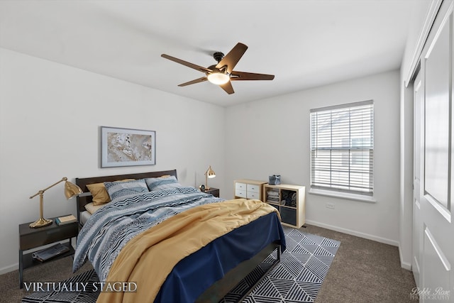 bedroom with a closet, a ceiling fan, baseboards, and carpet floors