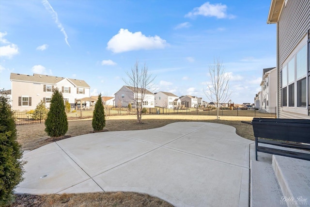 view of patio with a residential view and a fenced backyard