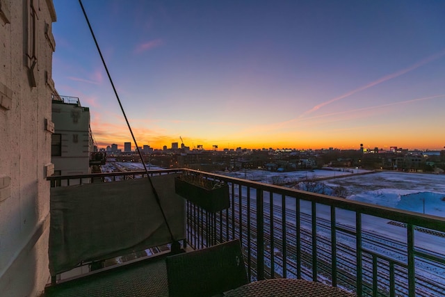 balcony at dusk with a city view