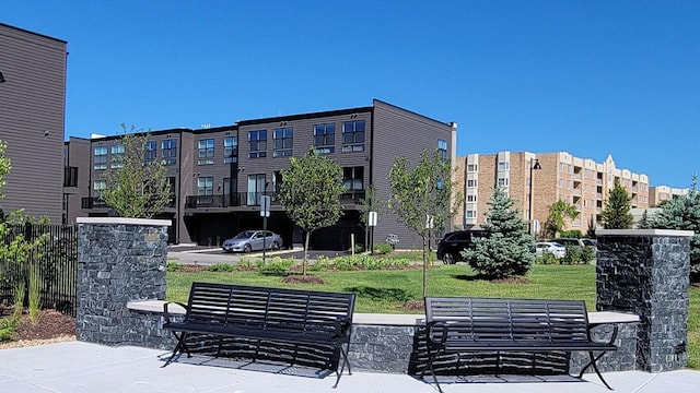 view of property's community with a lawn