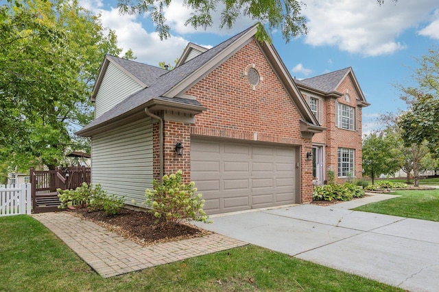 view of side of home with fence, roof with shingles, concrete driveway, an attached garage, and brick siding