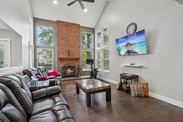 living room featuring baseboards, high vaulted ceiling, a ceiling fan, and wood finished floors