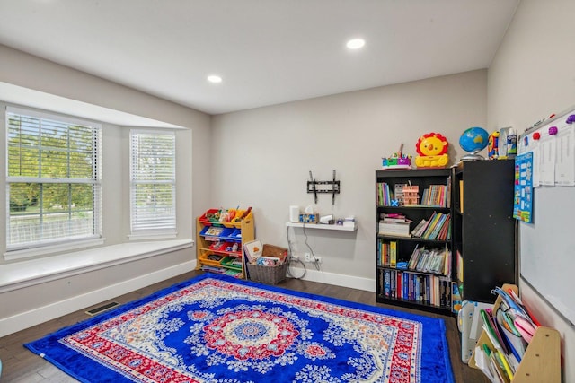 game room featuring visible vents, recessed lighting, baseboards, and wood finished floors