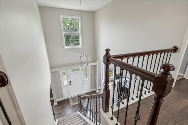 entryway featuring baseboards and wood finished floors