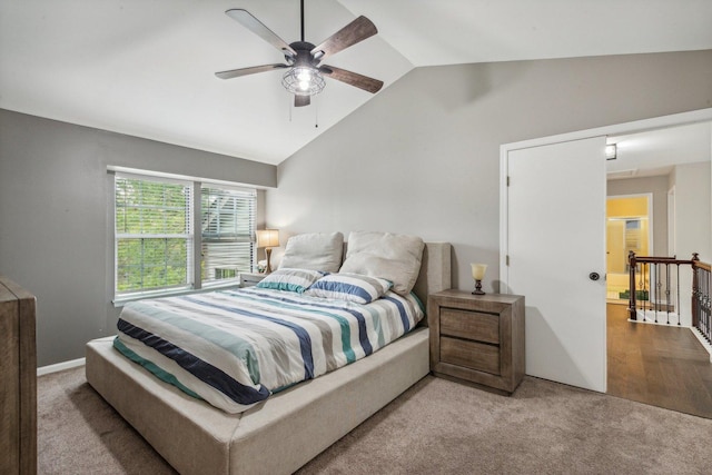 bedroom with vaulted ceiling, carpet, and ceiling fan