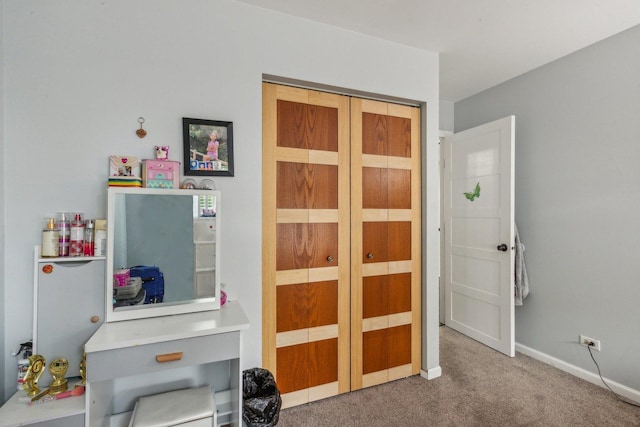 carpeted bedroom with baseboards