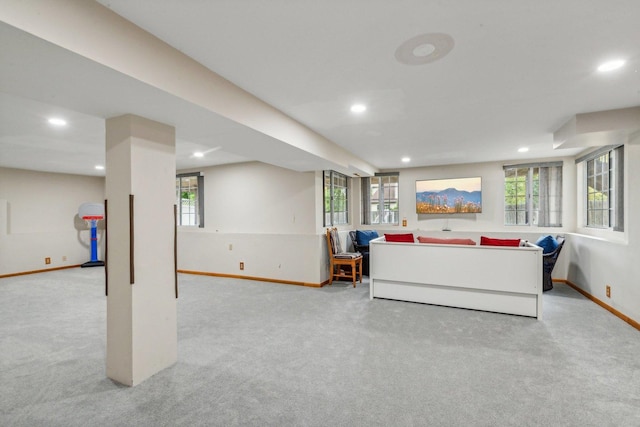 living room featuring carpet flooring, plenty of natural light, recessed lighting, and baseboards