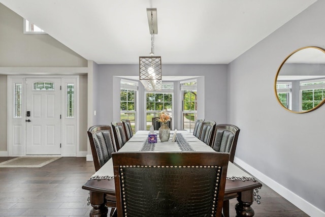 dining area with dark wood-style floors and baseboards