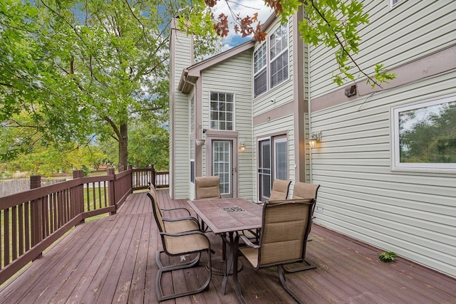 wooden deck featuring outdoor dining space