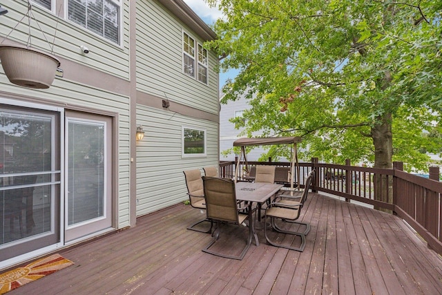 deck with outdoor dining space