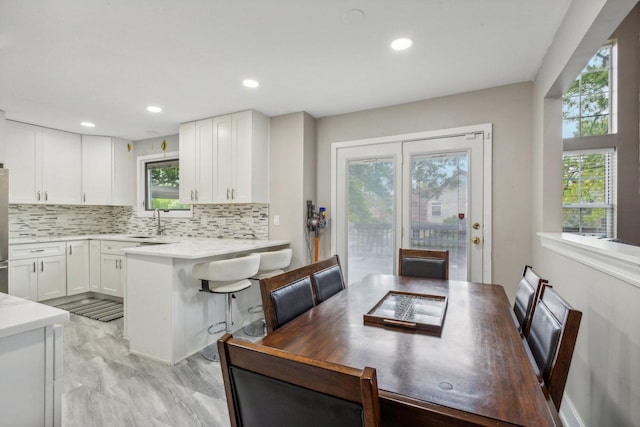 dining space featuring recessed lighting