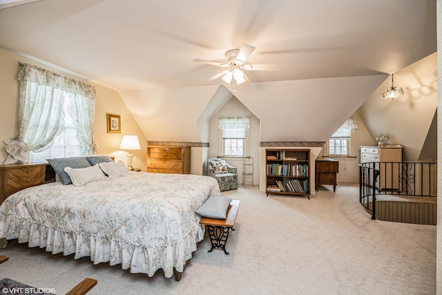 carpeted bedroom featuring lofted ceiling