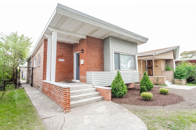 view of front of property featuring brick siding